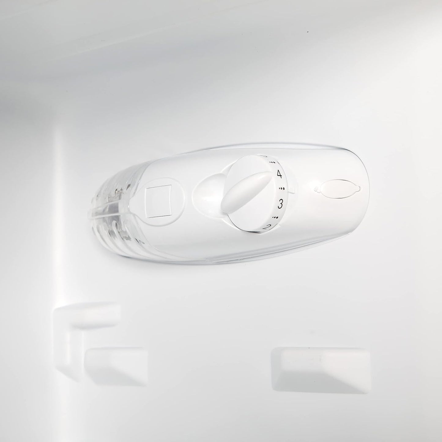 Temperature control dial for a fridge or freezer interior, featuring numbered settings for adjusting coldness.