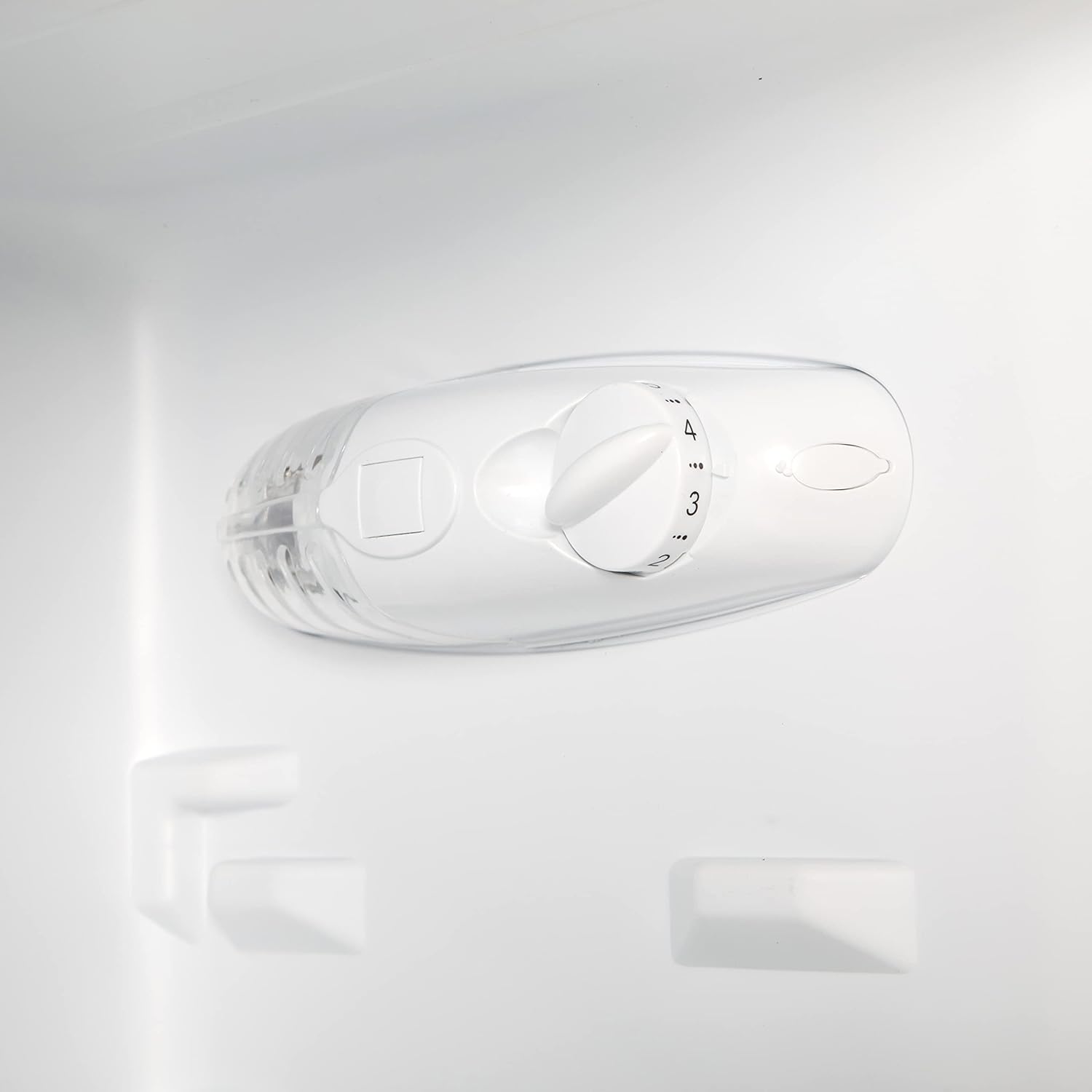 Temperature control dial for a fridge or freezer interior, featuring numbered settings for adjusting coldness.